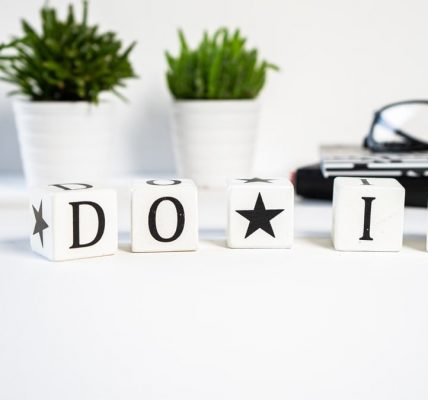 Inspiring office scene with 'Do It' blocks and plants, perfect for motivation.